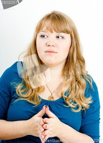 Image of portrait of a serious young blond woman