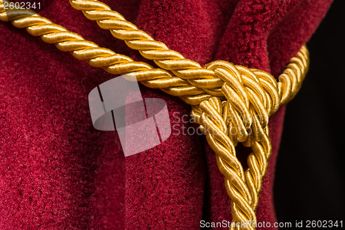 Image of Red velvet curtain with tassel