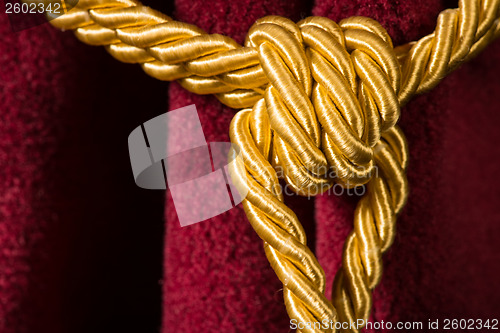 Image of Red velvet curtain with tassel