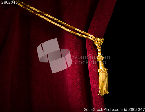 Image of Red velvet curtain with tassel