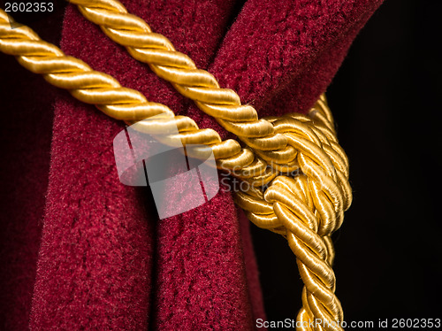 Image of Red velvet curtain with tassel