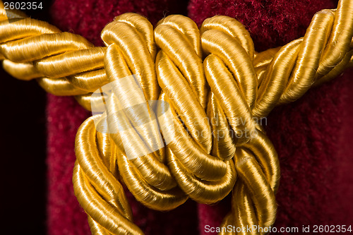 Image of Red velvet curtain with tassel