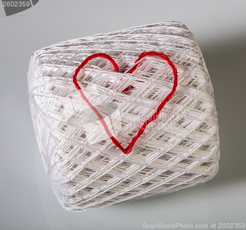 Image of Knitted red heart on white