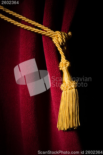 Image of Red velvet curtain with tassel