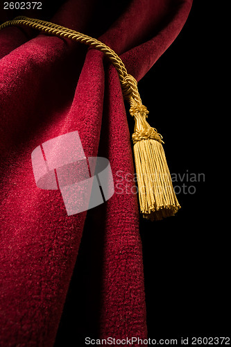 Image of Red velvet curtain with tassel