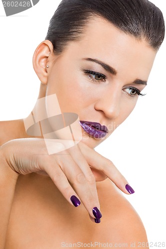 Image of Graceful attractive woman with purple lips and nails