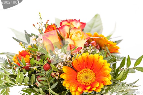 Image of Vivid orange gerbera daisy in a bouquet
