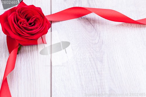 Image of Bouquet of red roses with ribbon border