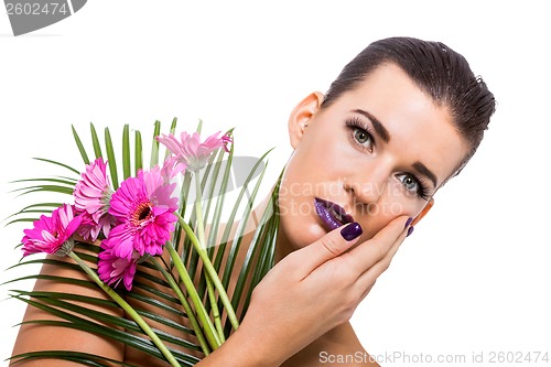 Image of Beautiful woman in purple make-up