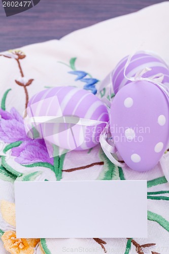 Image of colorful easter egg decoration on wooden background