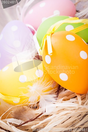 Image of colorful easter egg decoration on wooden background