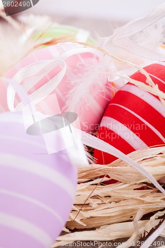 Image of colorful easter egg decoration on wooden background