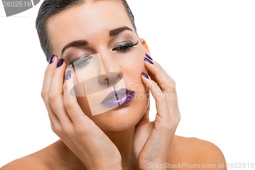 Image of Graceful attractive woman with purple lips and nails