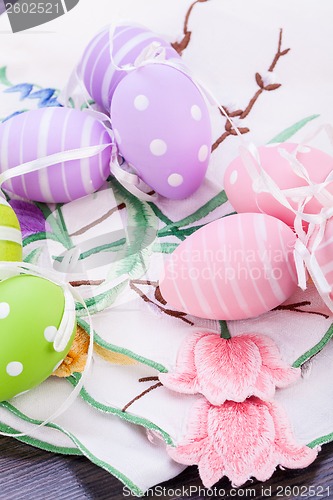 Image of colorful easter egg decoration on wooden background