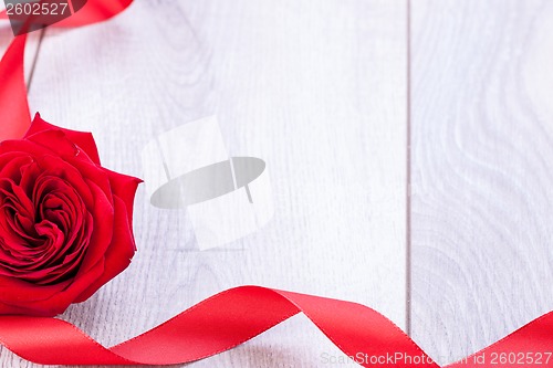 Image of Bouquet of red roses with ribbon border