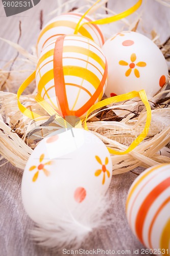 Image of Decorative Easter eggs, on a rustic wooden table