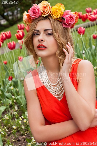 Image of beautiful woman with roses outdoor summertime