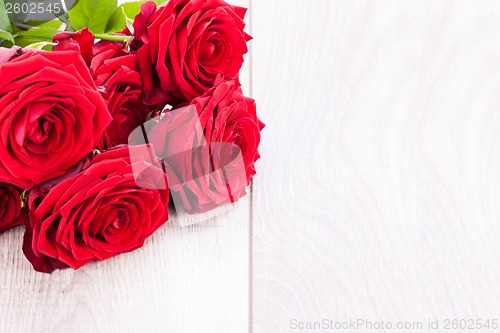 Image of beautiful red rose flower on black background