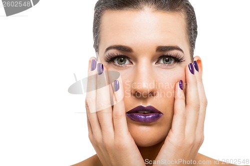 Image of Graceful attractive woman with purple lips and nails