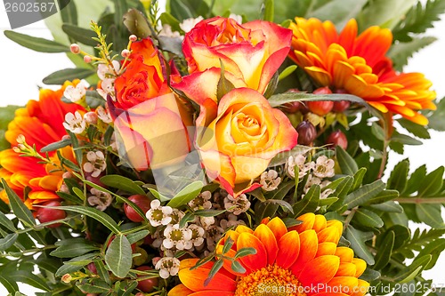 Image of Vivid orange gerbera daisy in a bouquet