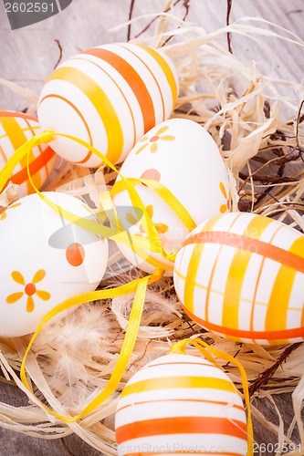 Image of Decorative Easter eggs, on a rustic wooden table