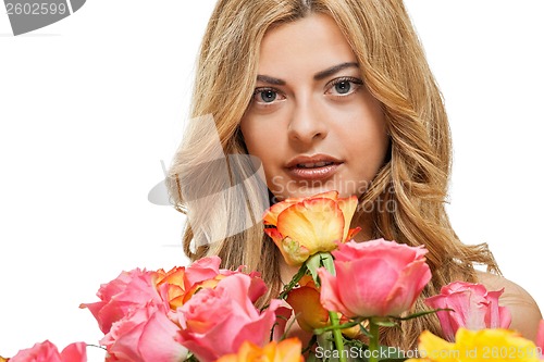 Image of attractive young smiling woman with flowers roses isolated