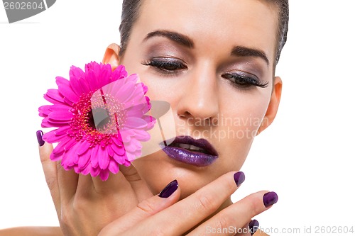 Image of Beautiful woman in purple make-up