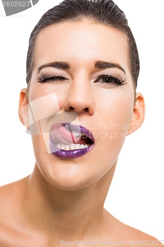 Image of Graceful attractive woman with purple lips and nails