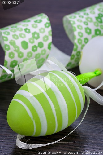 Image of Colourful green Easter eggs in straw