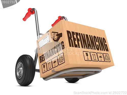 Image of Refinancing - Cardboard Box on Hand Truck.