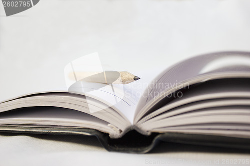 Image of Pencil on a book