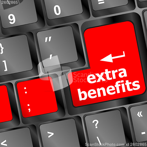 Image of extra benefits button on keyboard - business concept