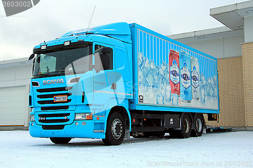 Image of Turquoise Scania R500 Delivering Goods to a Store