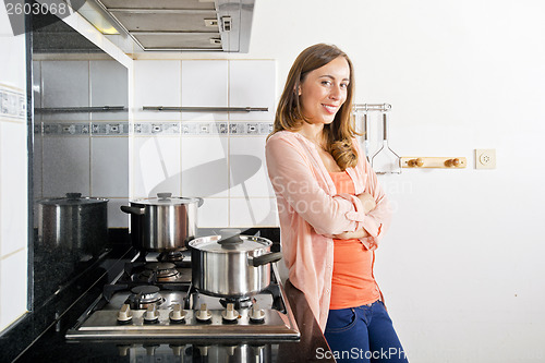 Image of Woman posing in a kitchen