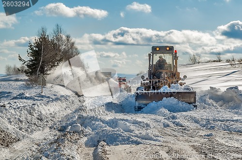 Image of truck cleaning road in winter