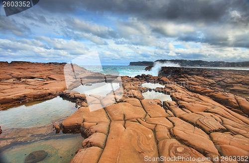 Image of Waves splash on magnificent rock formations