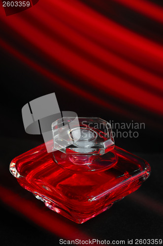 Image of red perfume bottle 