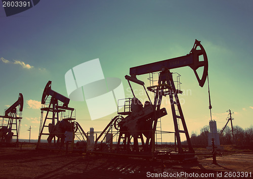 Image of oil pumps silhouette - vintage retro style