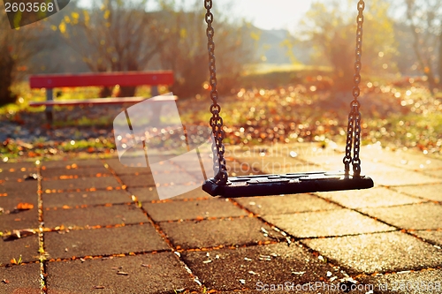 Image of Playground swing in a park