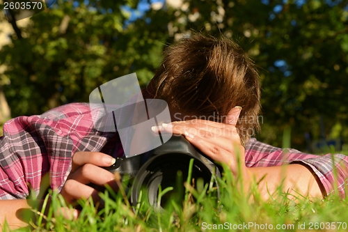 Image of My beloved one taking photos on the ground