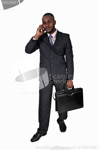 Image of Black man with cell phone.