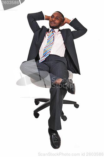 Image of Black man in office chair.