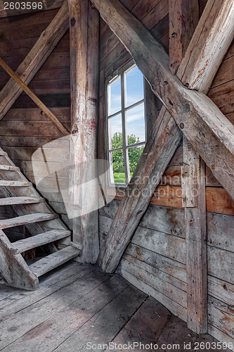 Image of Interior of an abandoned wooden house with staircase