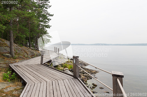 Image of Rocky lakeshore with wooden pathway