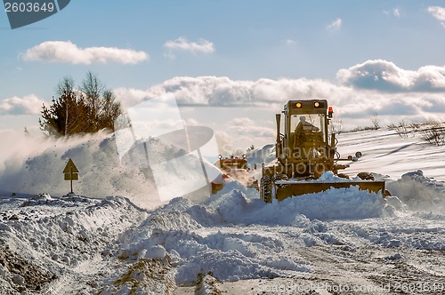 Image of Grader cleaning road in winter