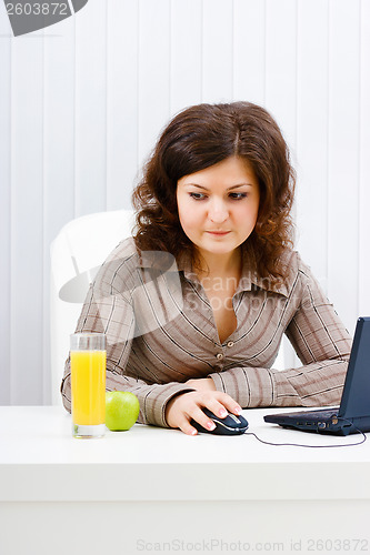 Image of Young woman in office