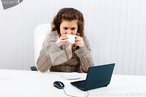 Image of Young woman in office