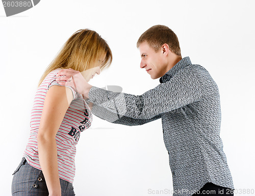 Image of young woman fighting with a man