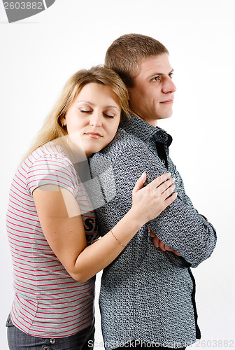 Image of young woman hugging man