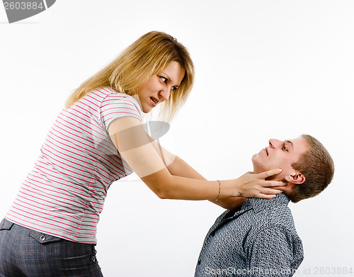 Image of young woman fighting with a man